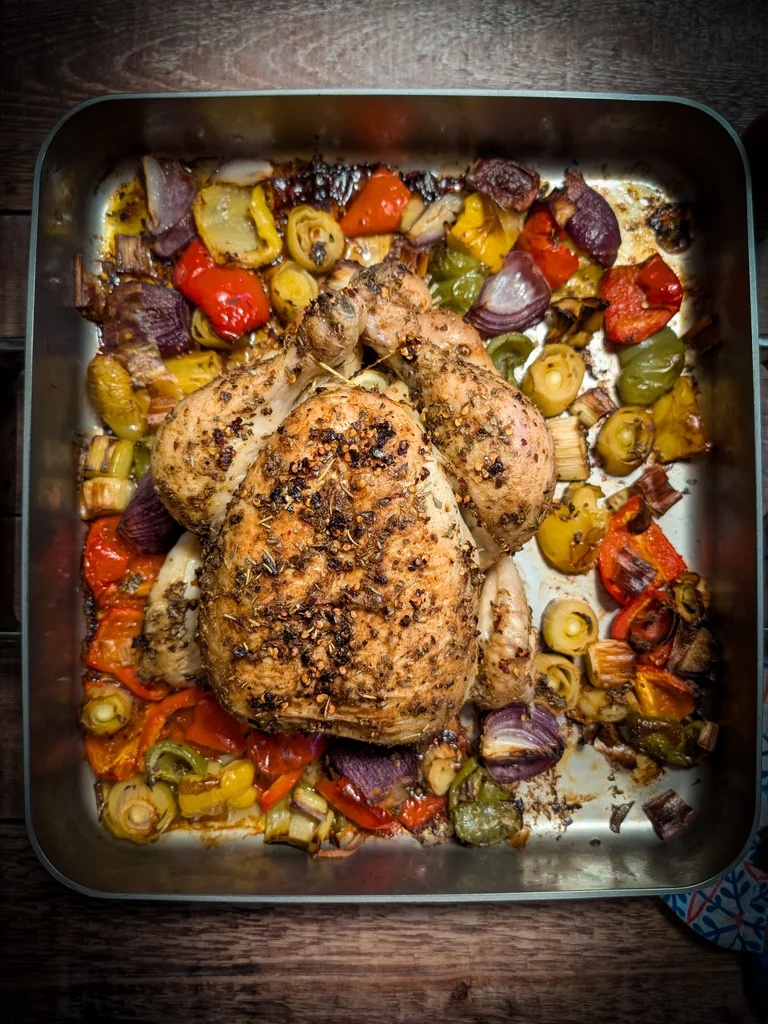 Spicy Lemon & Herb Roast Chicken with Peppers & Leeks recipe image